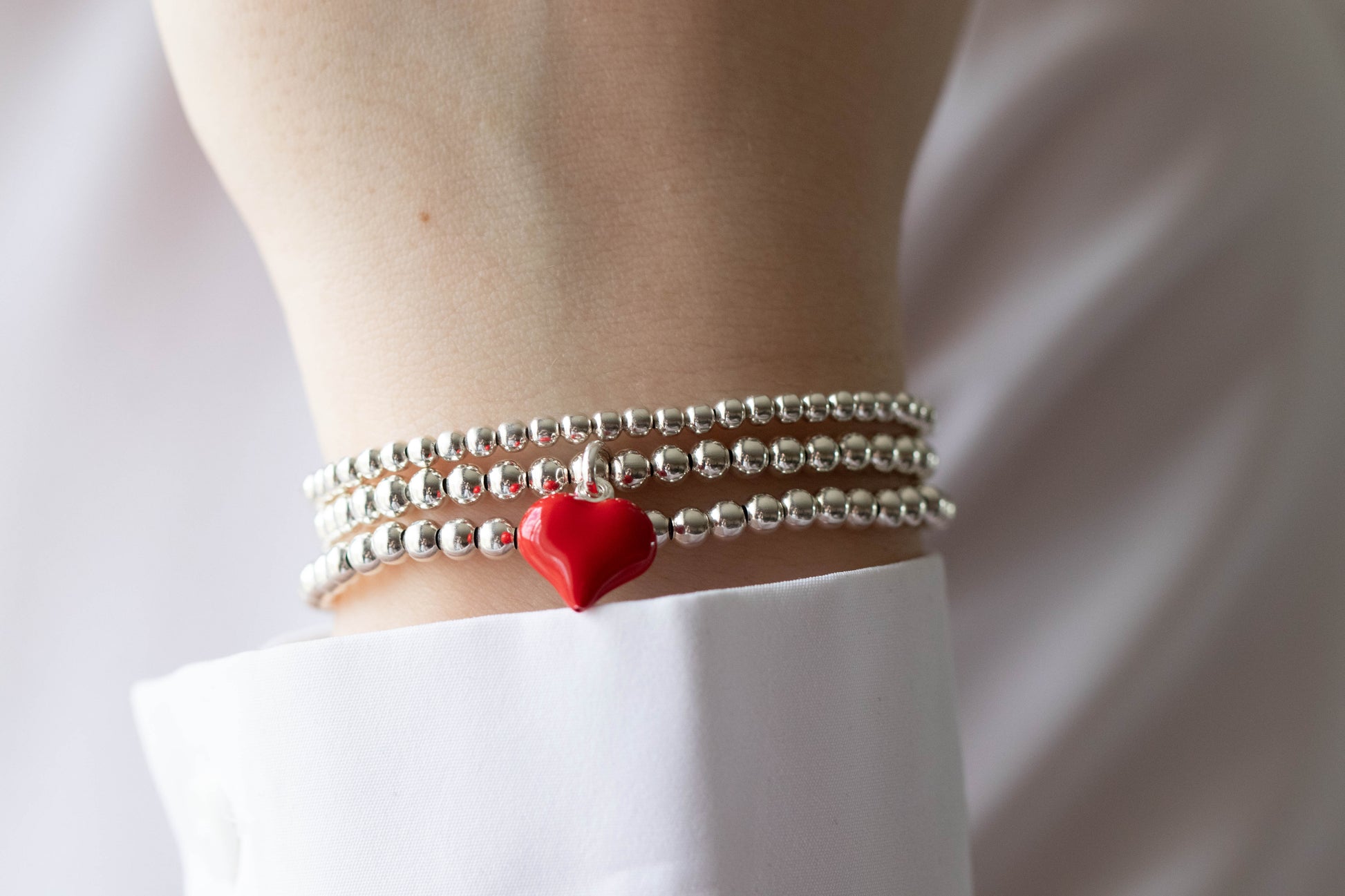 Sterling silver puff heart charm bracelet