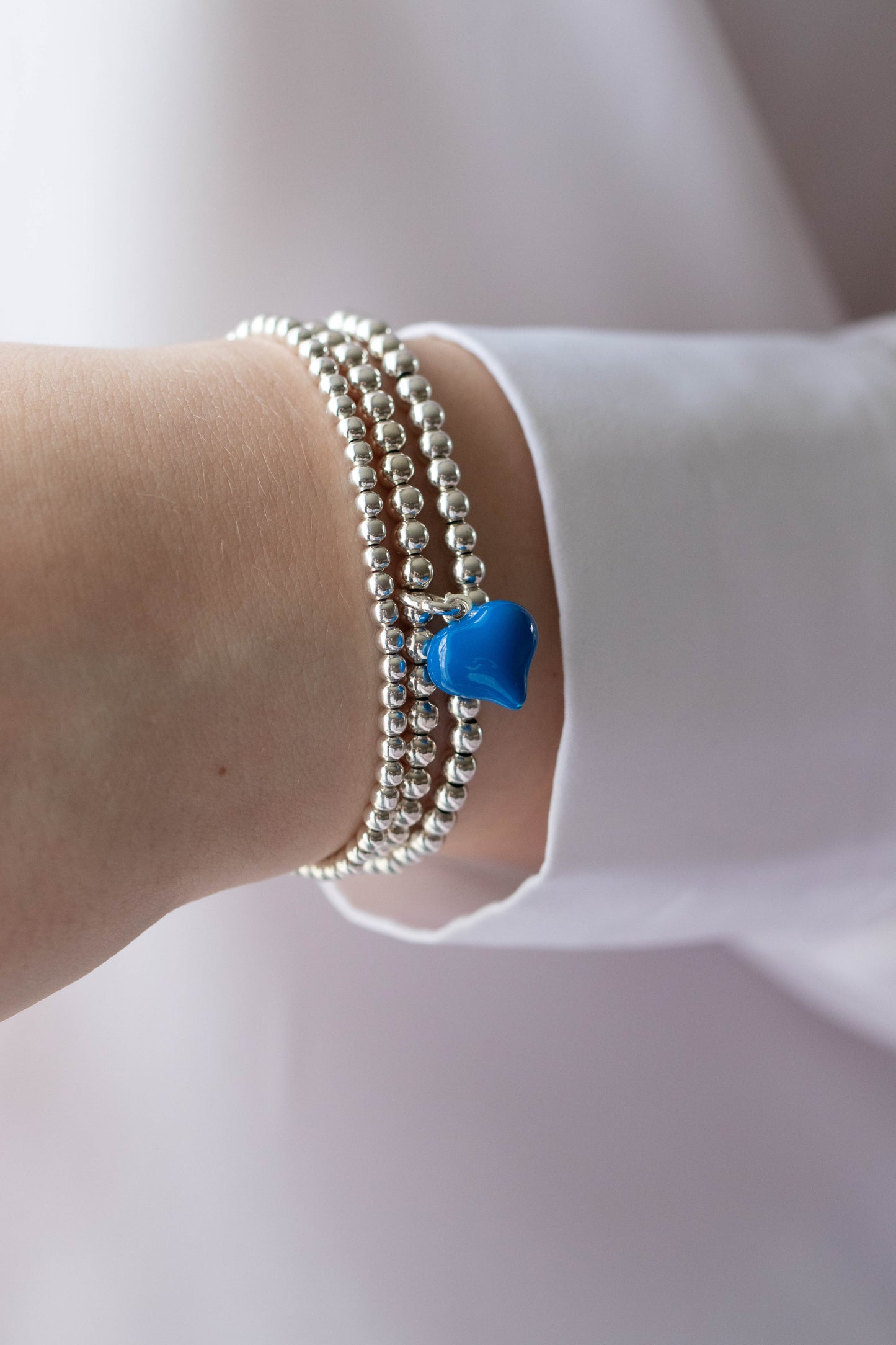 Sterling silver blue puff heart charm bracelet