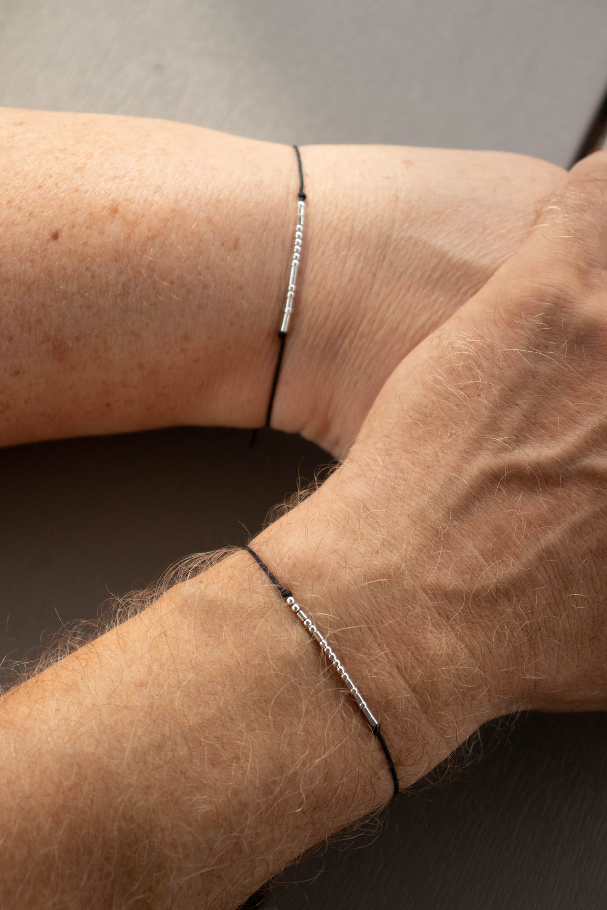 Personalized Morse Code couple bracelets set of 2 with 925 sterling silver beads on black cord.